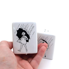 One shaker with 3 holes and one with 2 holes