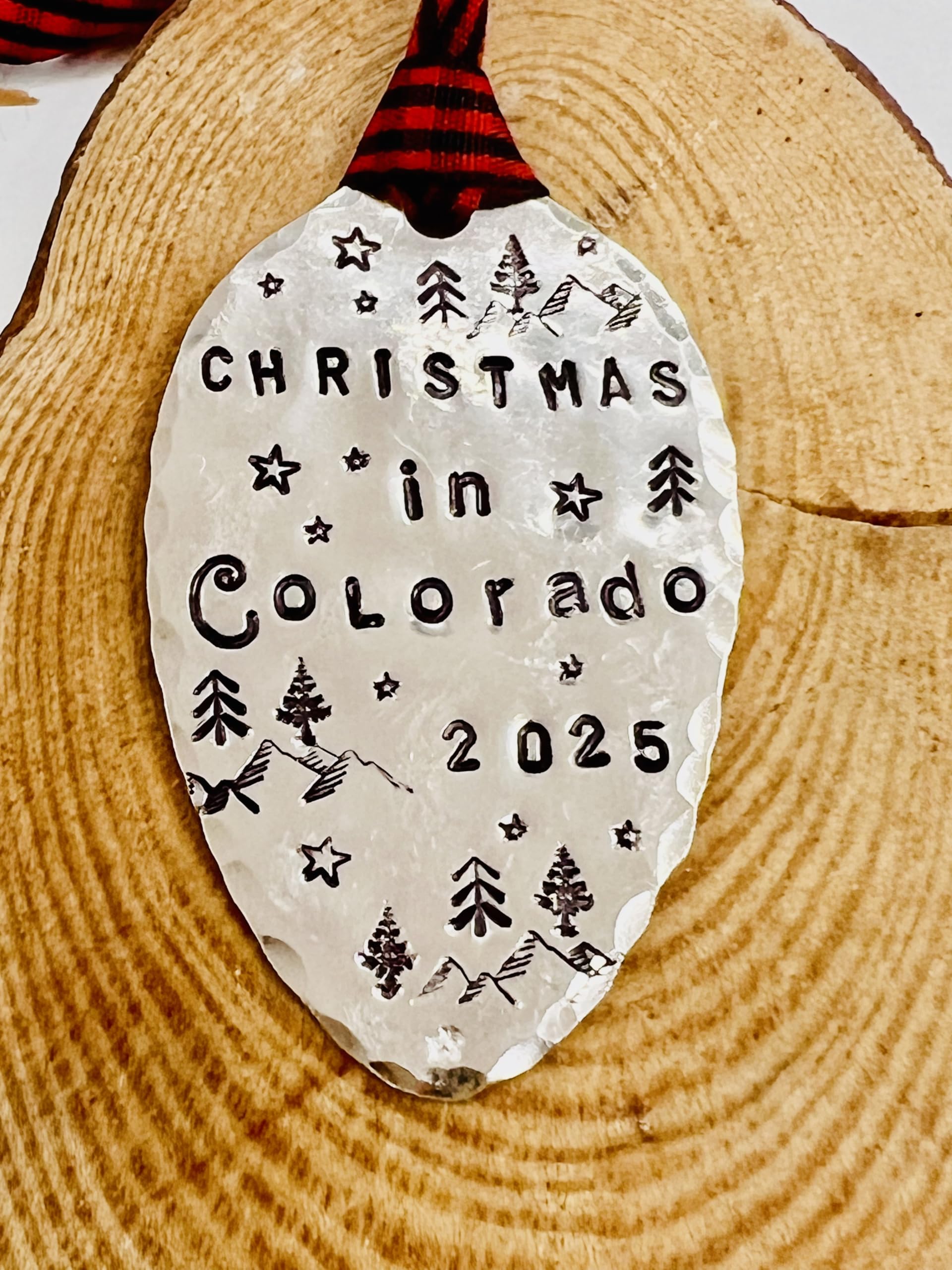 Colorado themed ornament with mountains and stars and ribbon