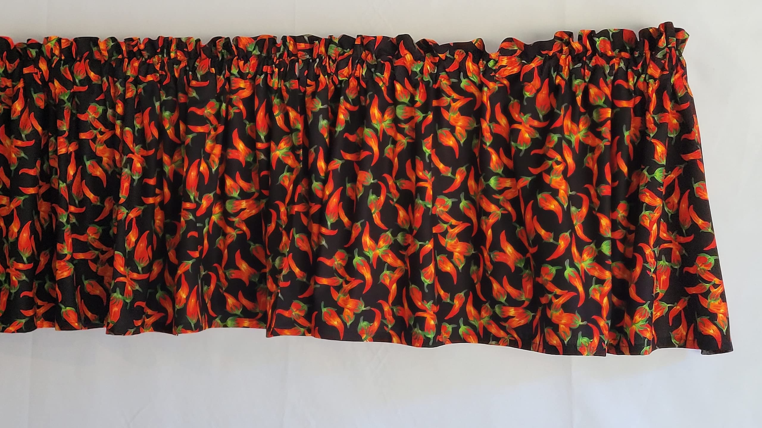 Red chili pepper motif across valance fabric