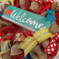 Red mesh wreath with yellow accents