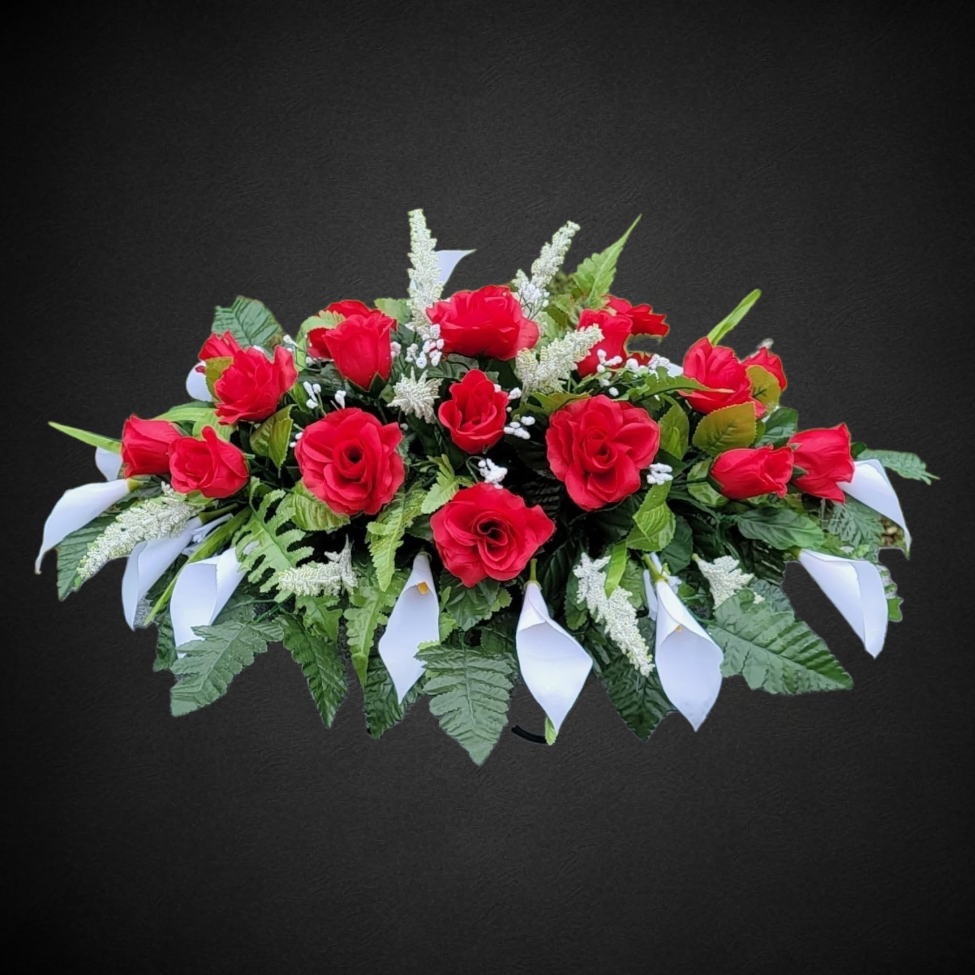 Silk faux floral grave flowers featuring red roses and white calla lilies
