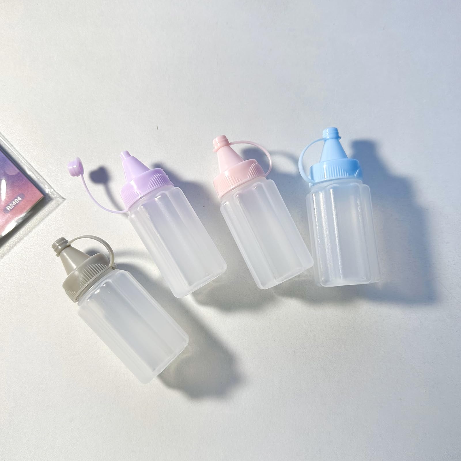 Eight 30ml mini condiment squeeze bottles in grey color
