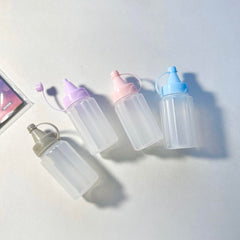 Eight 30ml mini condiment squeeze bottles in grey color