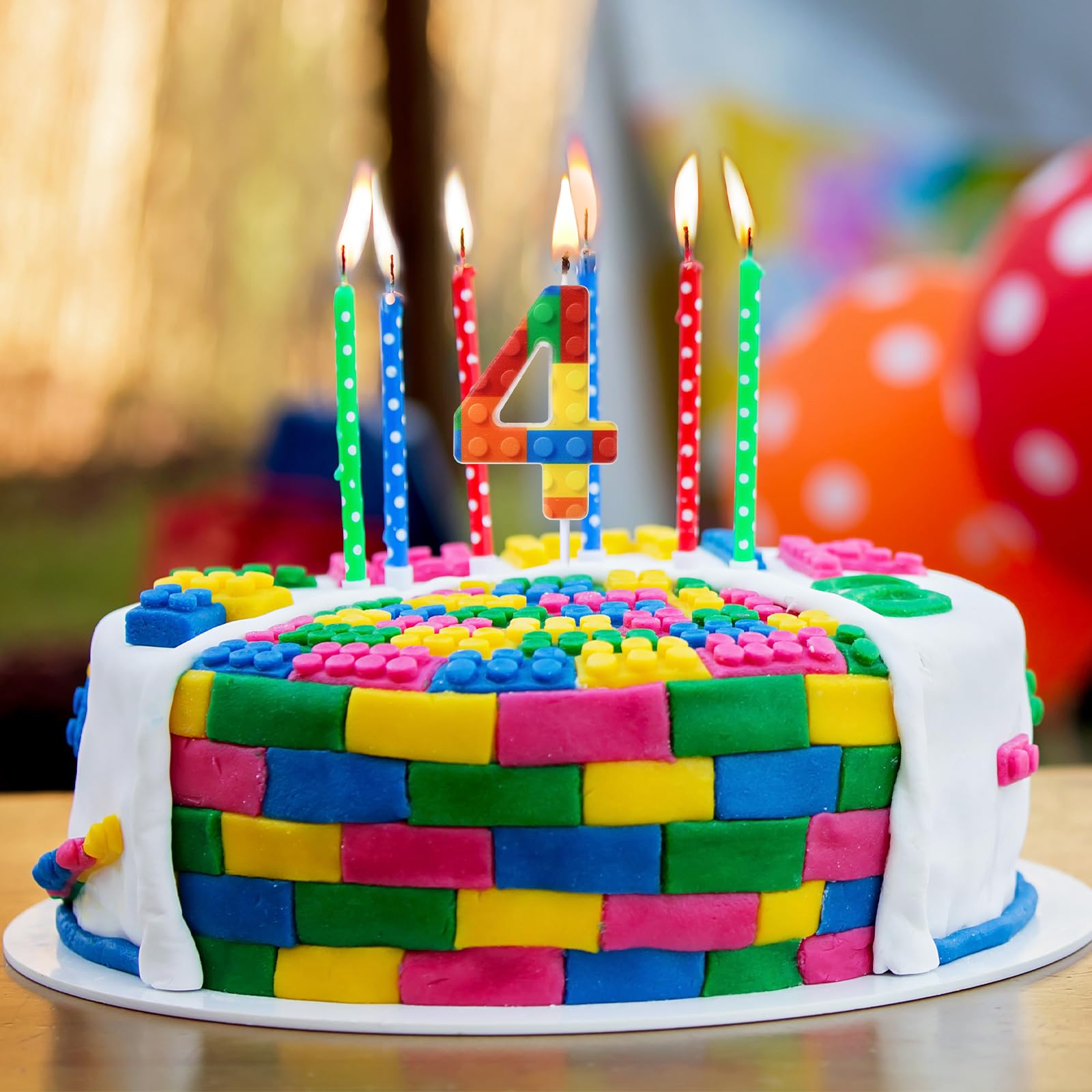 Building block birthday candle used to decorate cakes