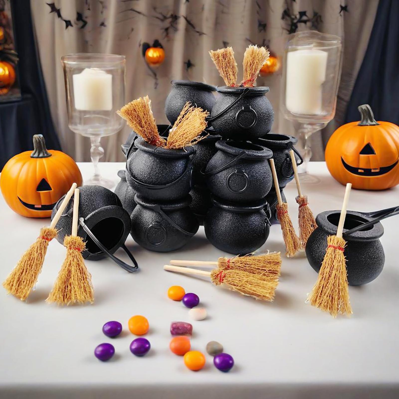Halloween party favors with mini cauldrons and brooms