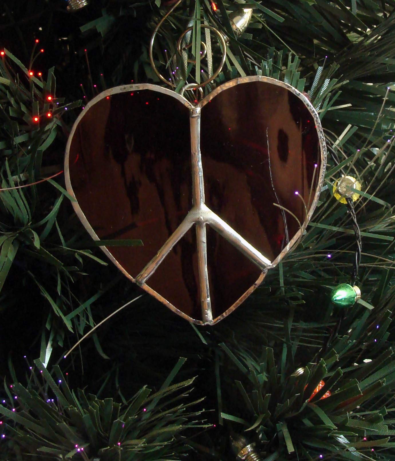 Ruby red heart glass ornament on display