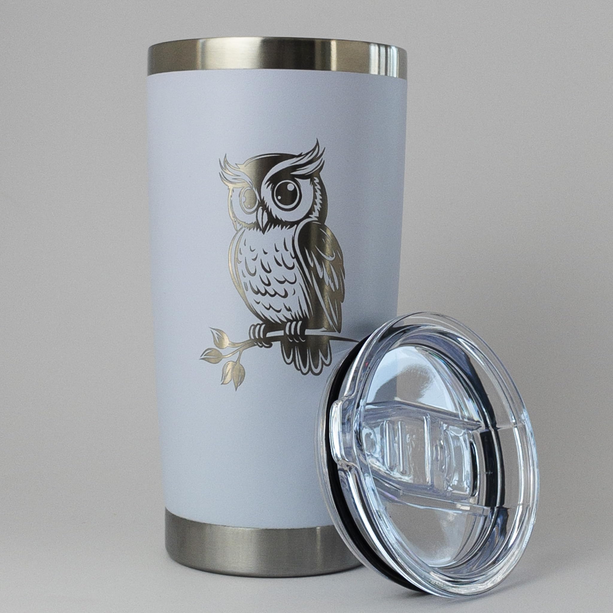 Owl Tumbler 20 oz sliding lid close up with stainless steel body