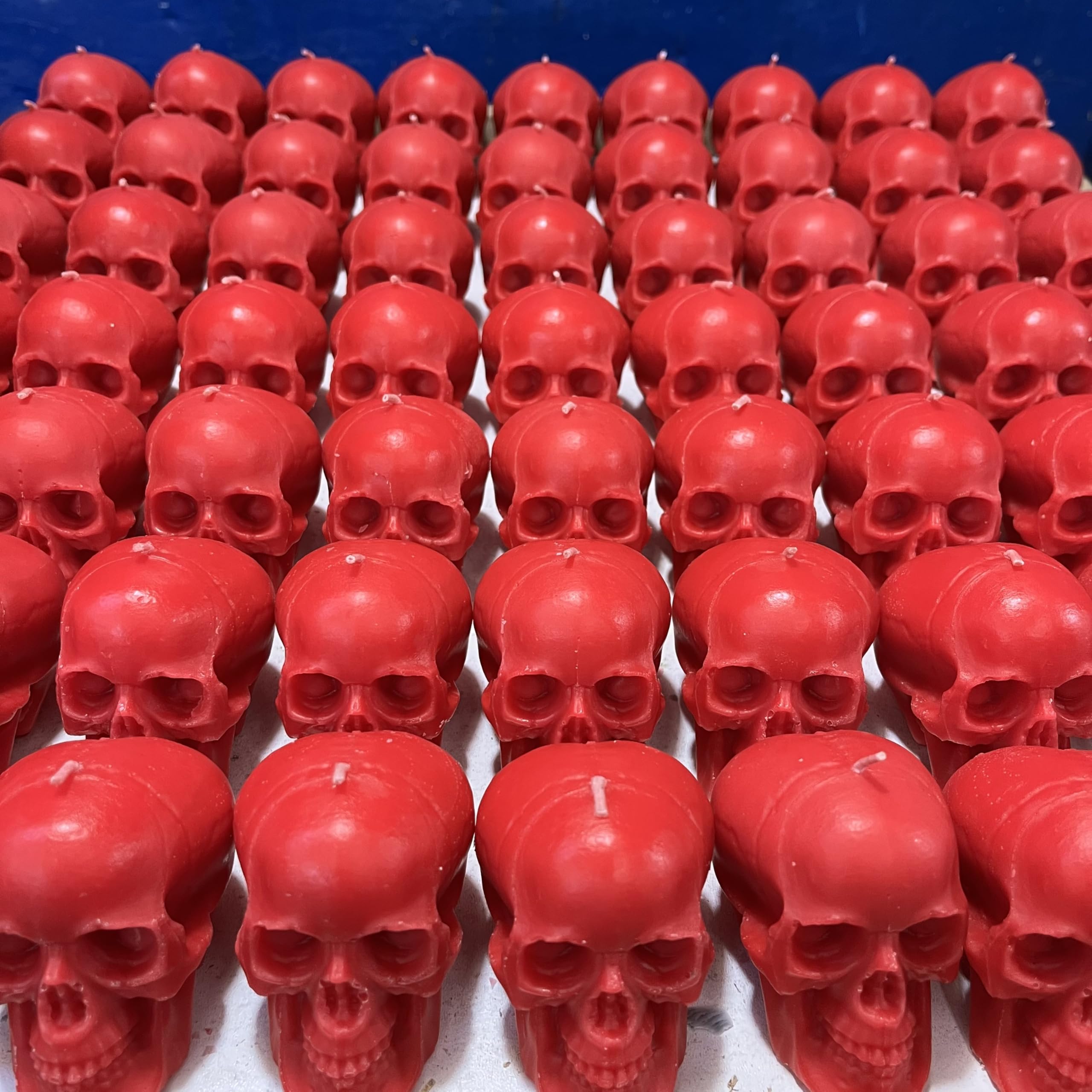 Satanic skeleton themed red skull candles display