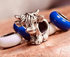 Sterling silver cow charm bead in gift pouch