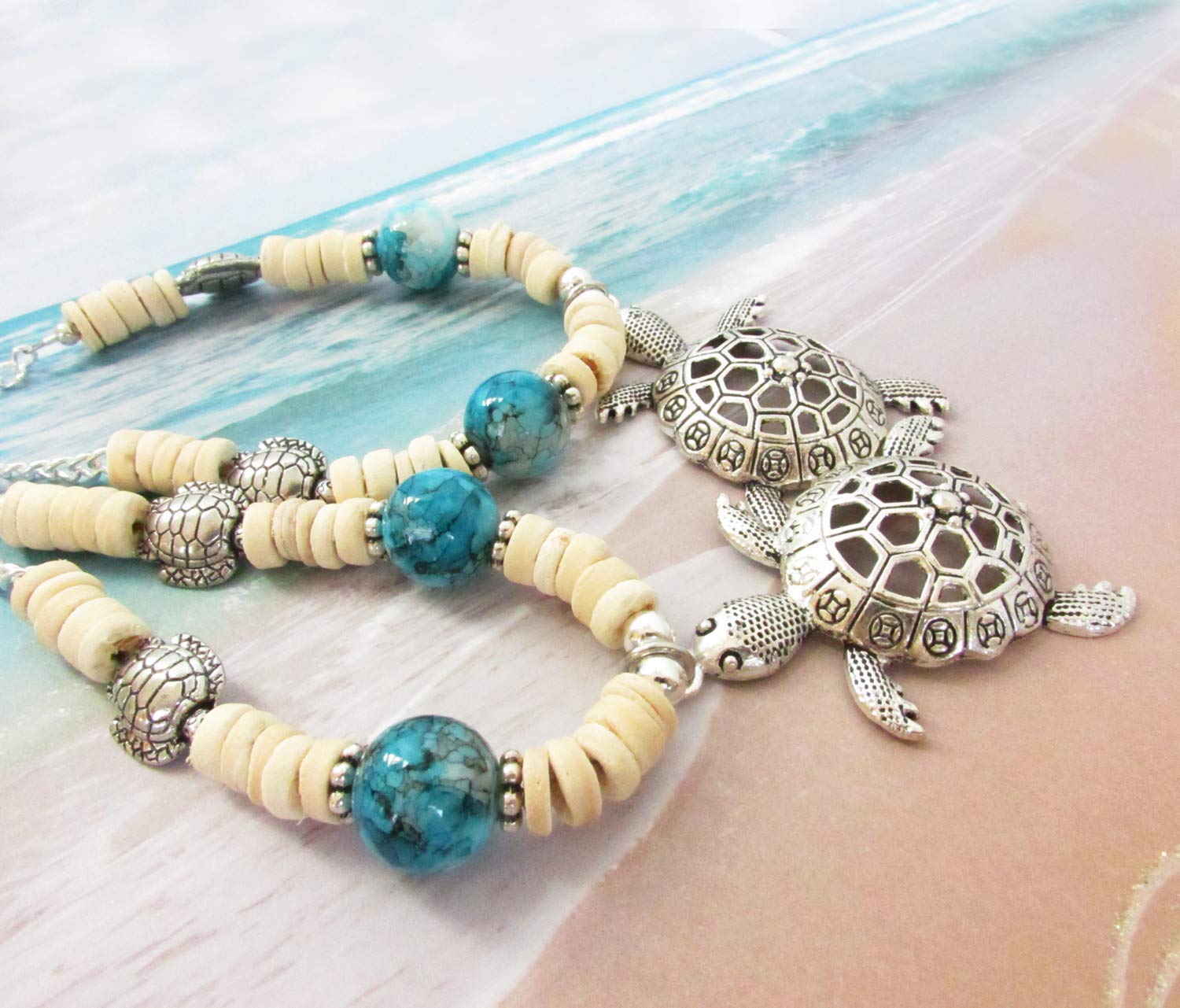 Silver tone turtle charms on each strand