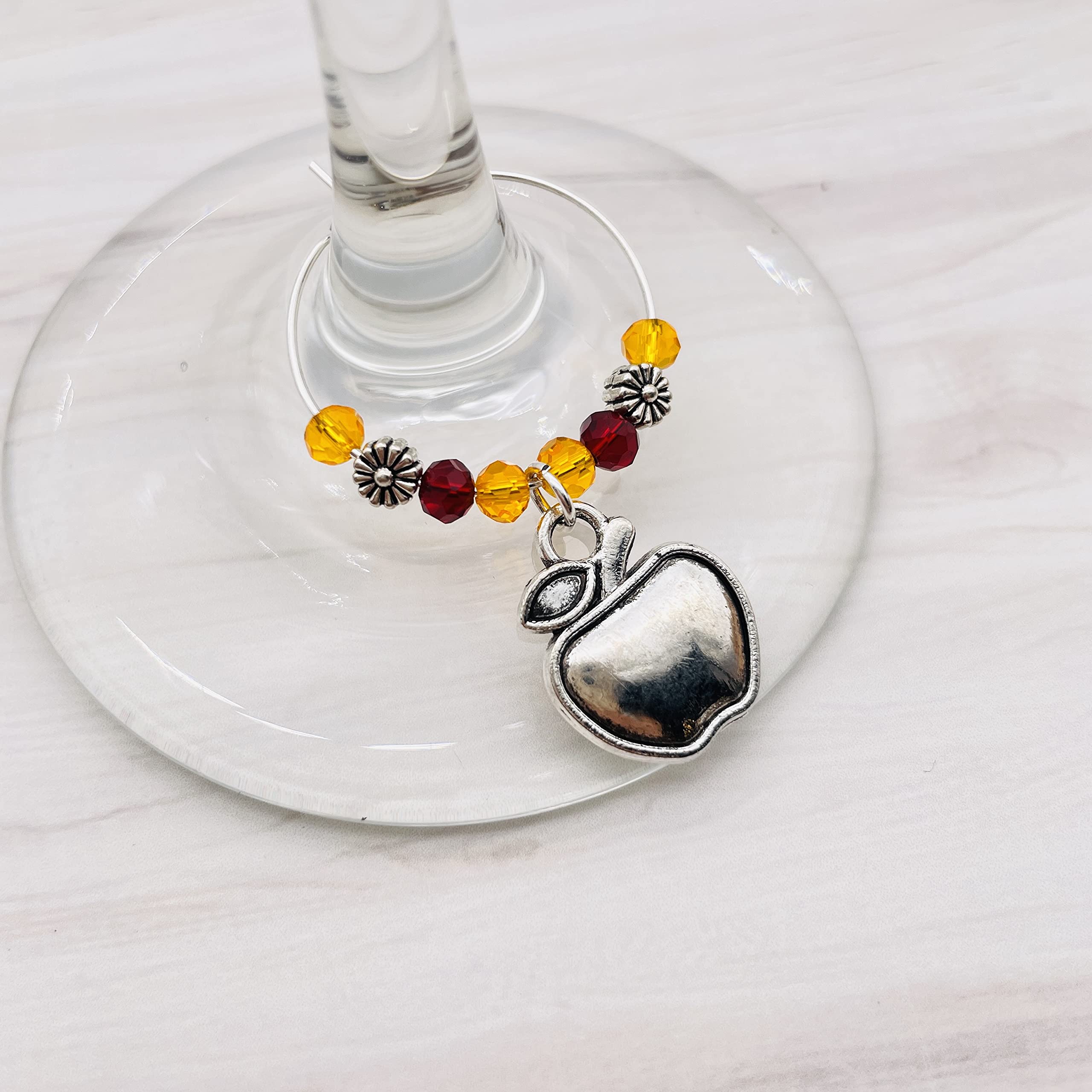 Wine glass charms attach to stem with silver hoop