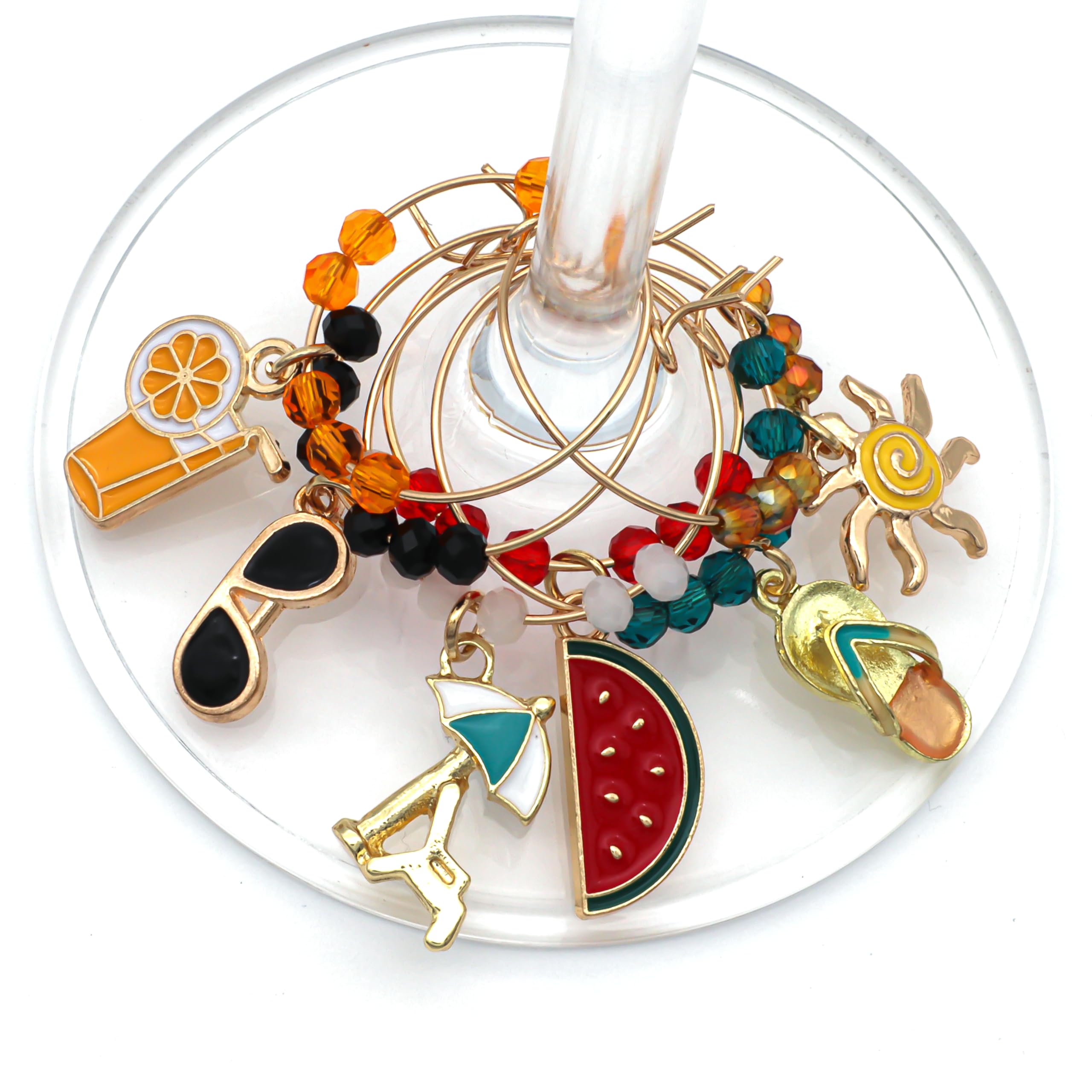 Summer themed wine glass charms featuring sun bed sun sunglasses and other symbols by Serendipity Presents