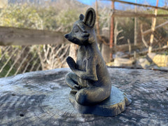 Zen inspired raccoon figurine for office space