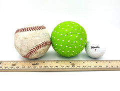 Fabric wrapped ornament ball close-up showing polka dot pattern