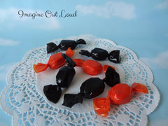 Faux candy prop display in Halloween decor bowls and jars