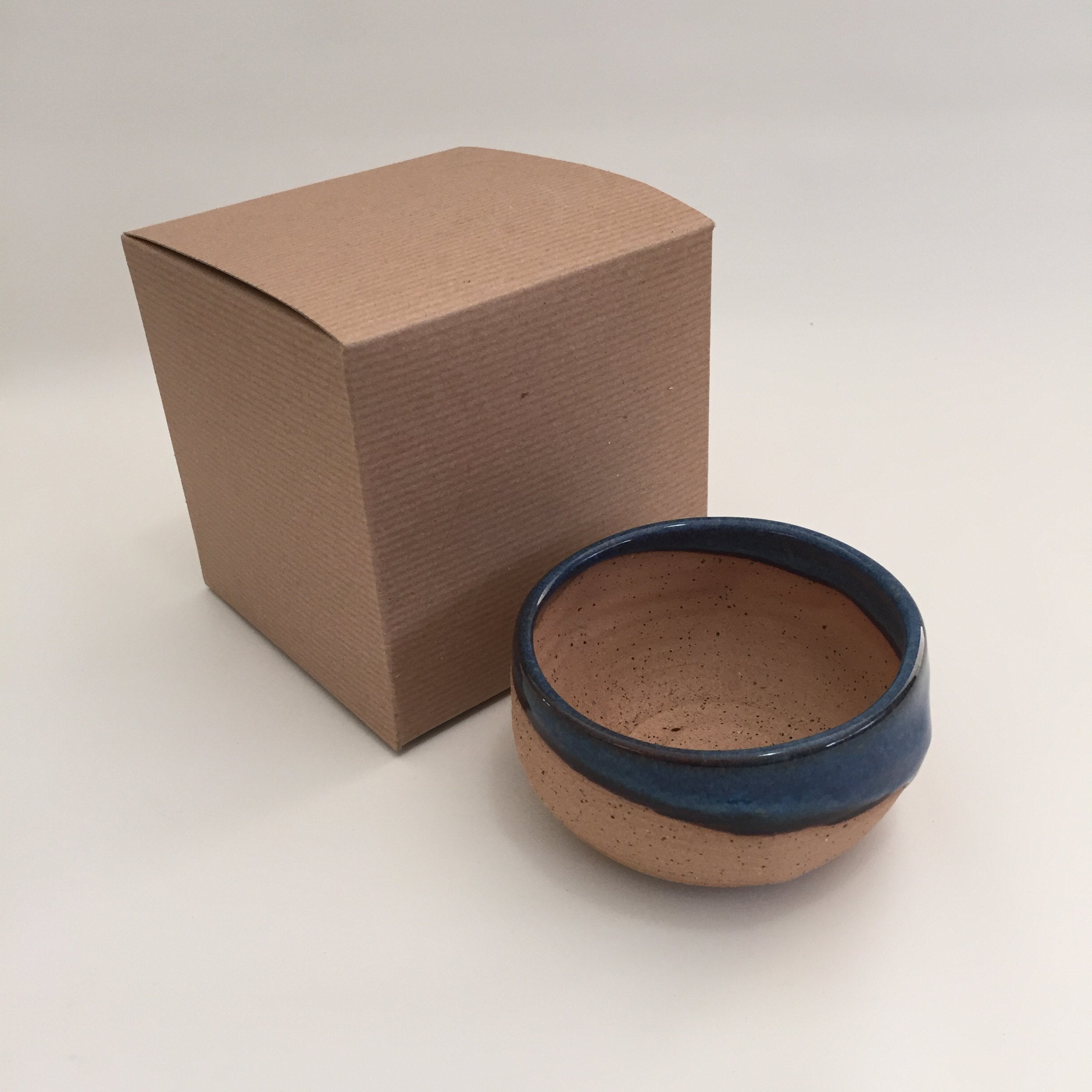 Unglazed interior holds soap puck for lather