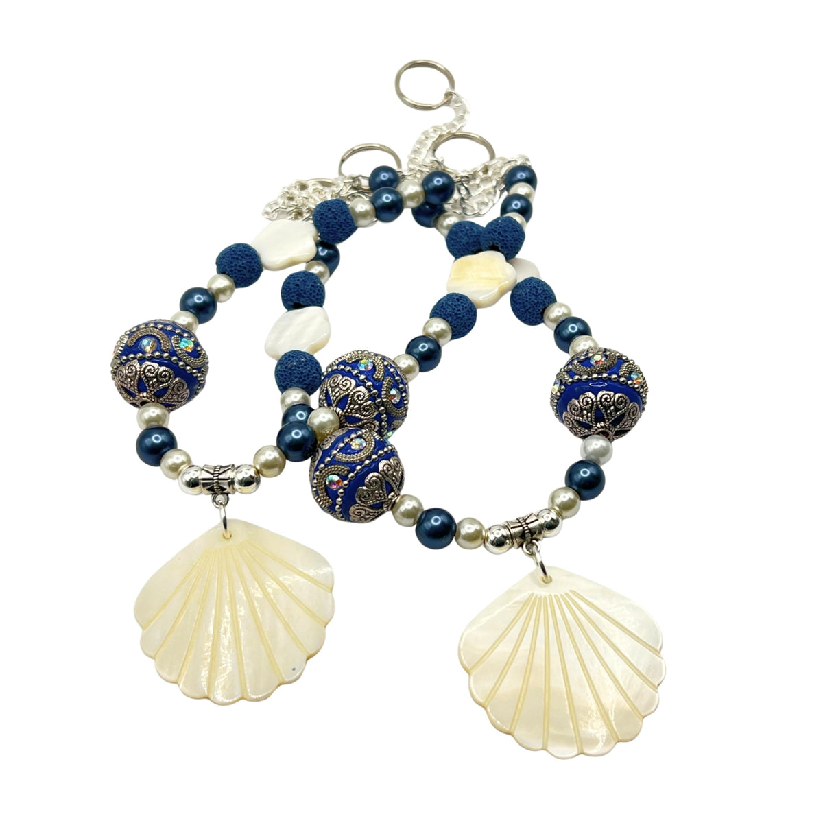 Seashell curtain tiebacks with navy blue beads