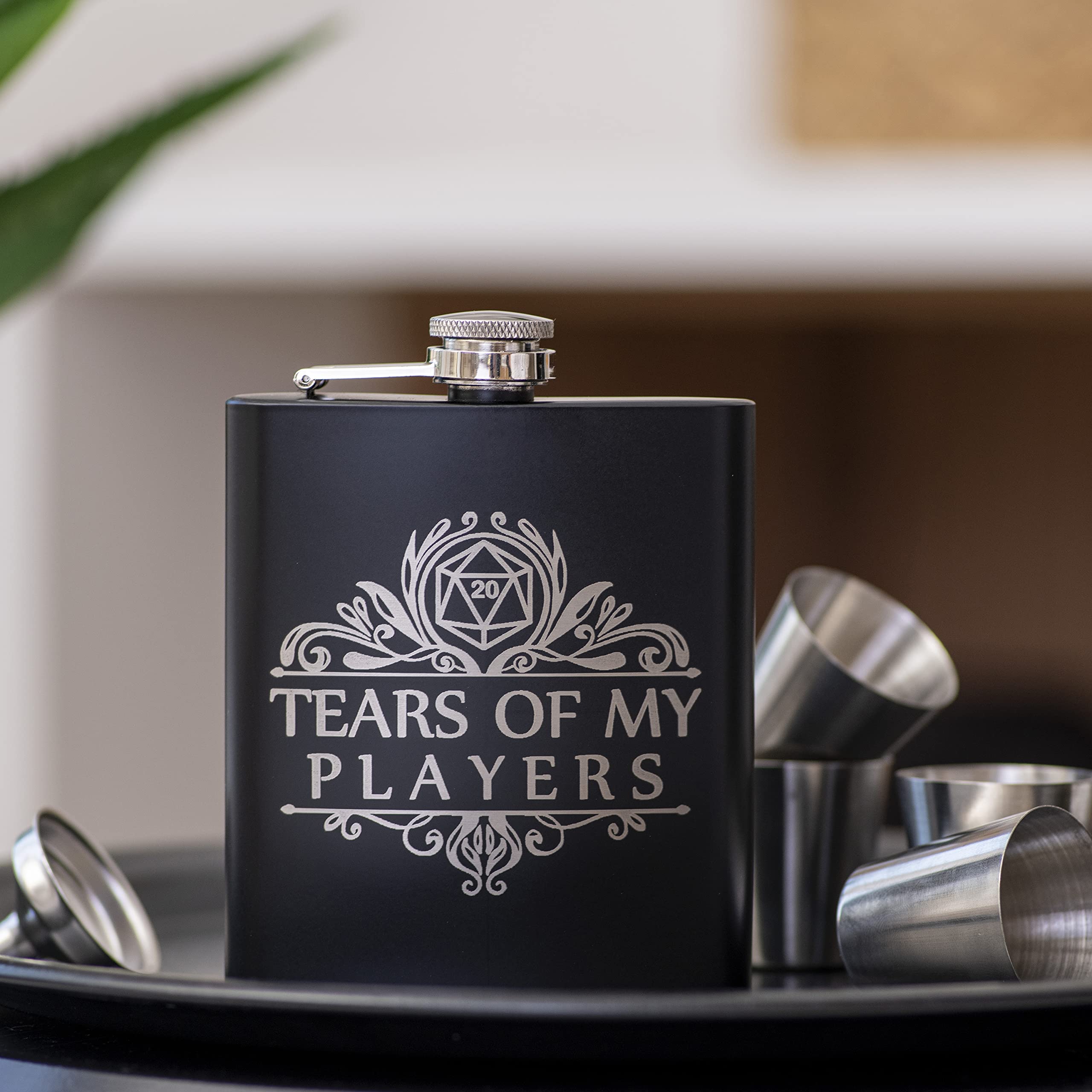 Four shot glasses in leather case
