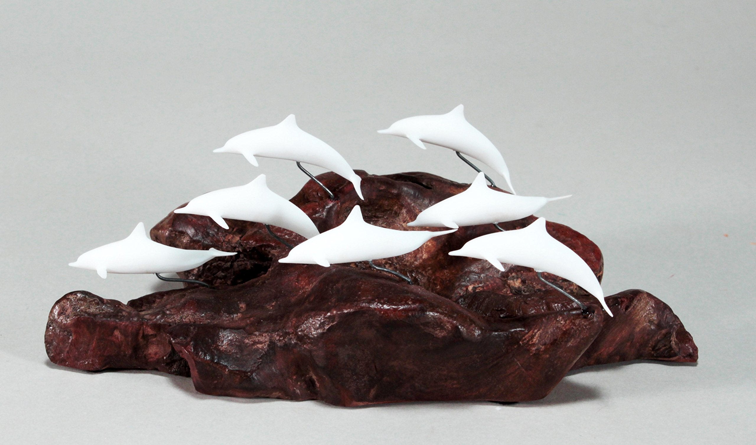 Pellucida resin dolphins on natural burl base