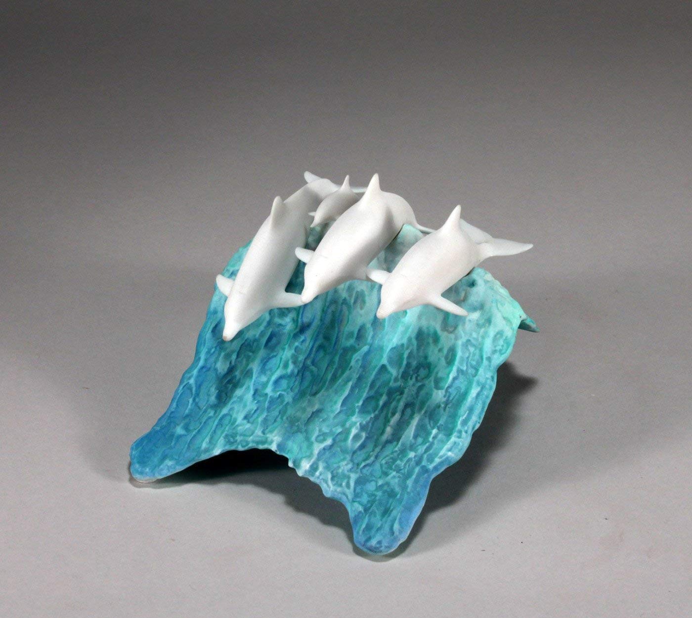 Dolphin sculpture with blue wave base dimensions 5 tall and 8 long
