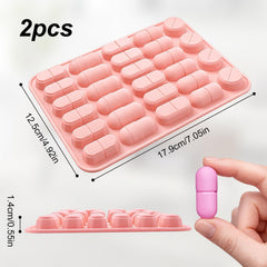 Blue silicone pill mold tray with 28 capsules across 5 sizes
