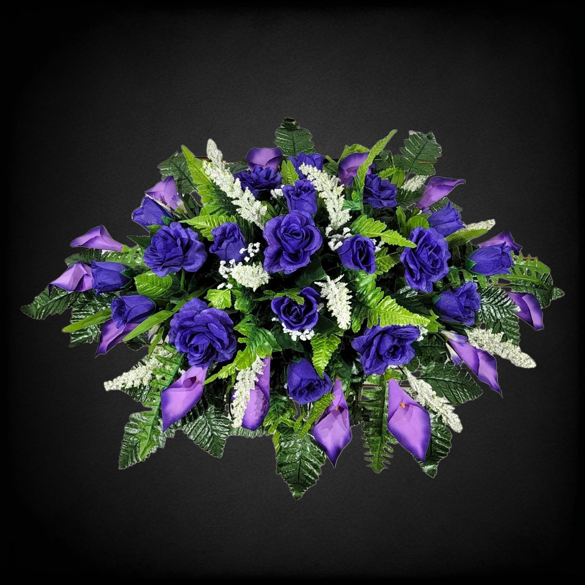 Silk grave flowers roses and calla lilies on saddle