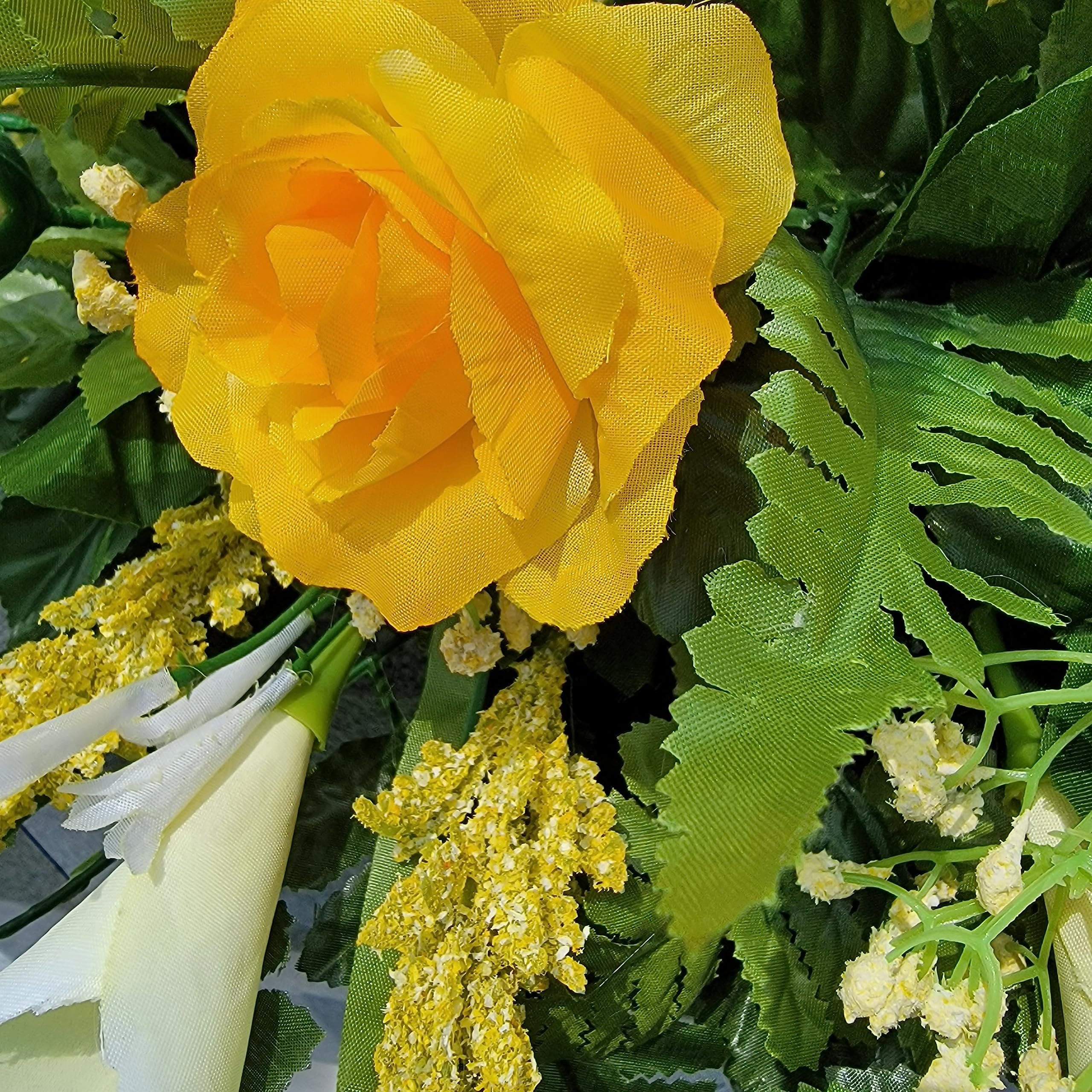 Silk rosebuds and baby's breath in saddle arrangement