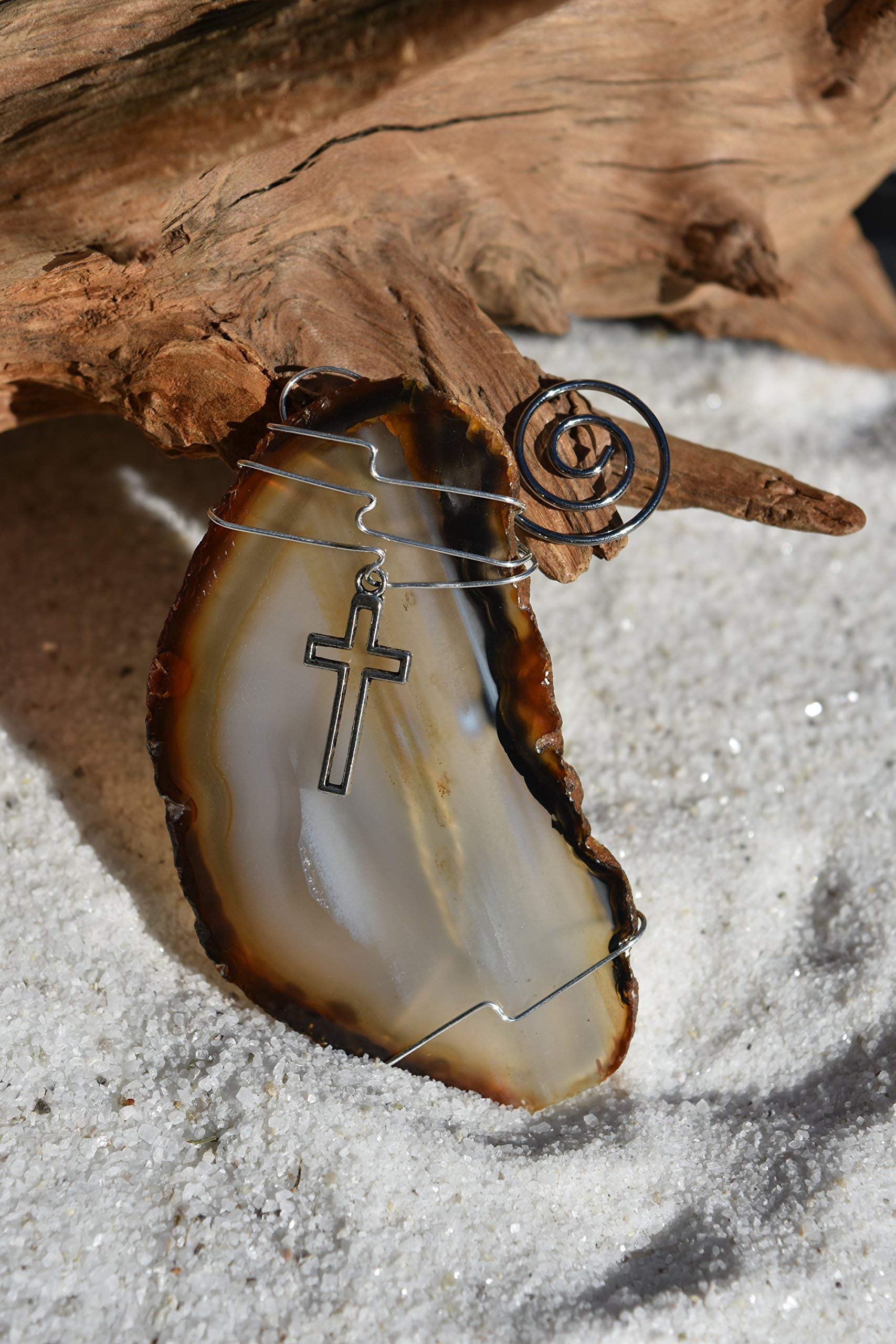 Silver cross charm agate slice ornament close up