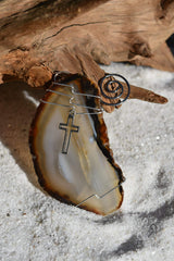 Silver cross charm agate slice ornament close up