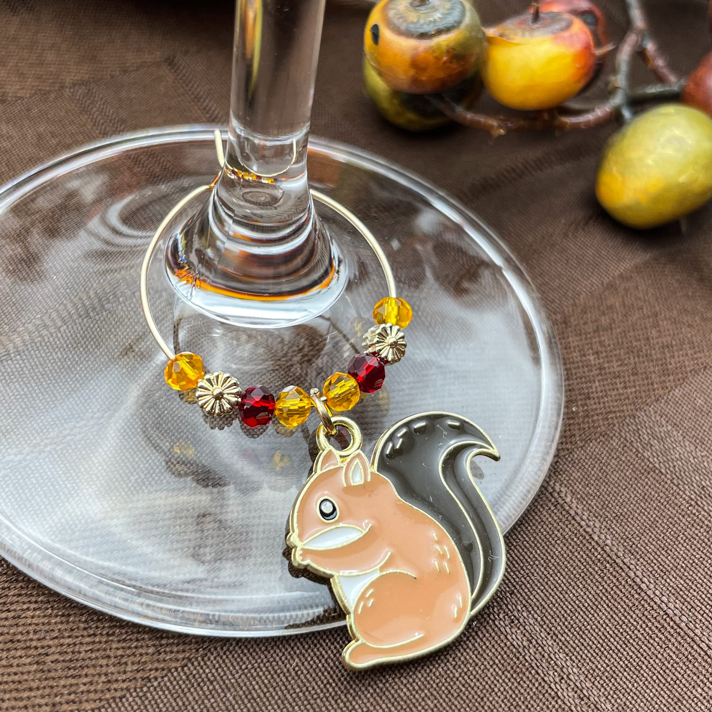 Wine glass charms attached to stems with silver hoop