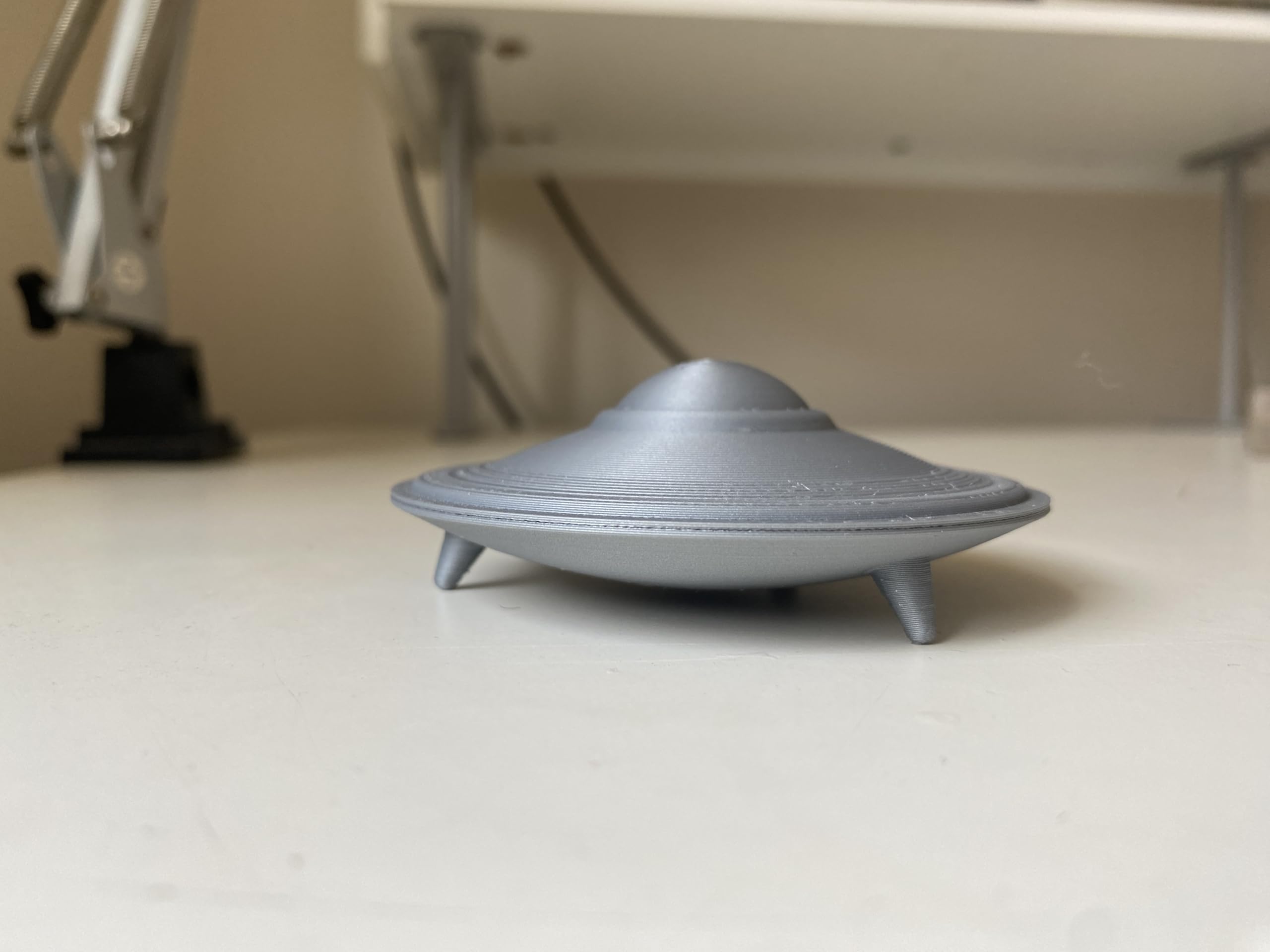 Silver colored UFO desk ornament