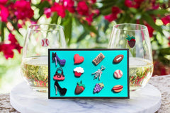 His and Hers magnetic wine charms close up