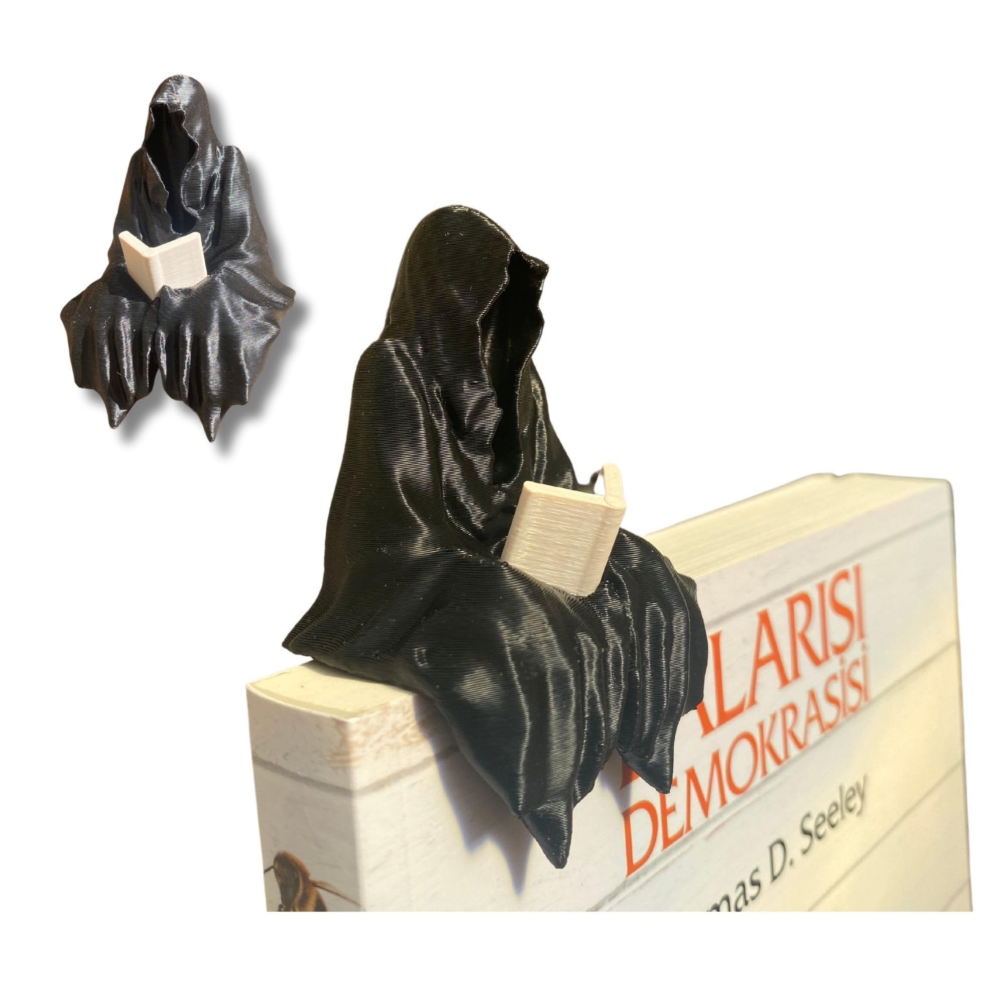 Sitting Ghost Figurine Reading a Book on a desk