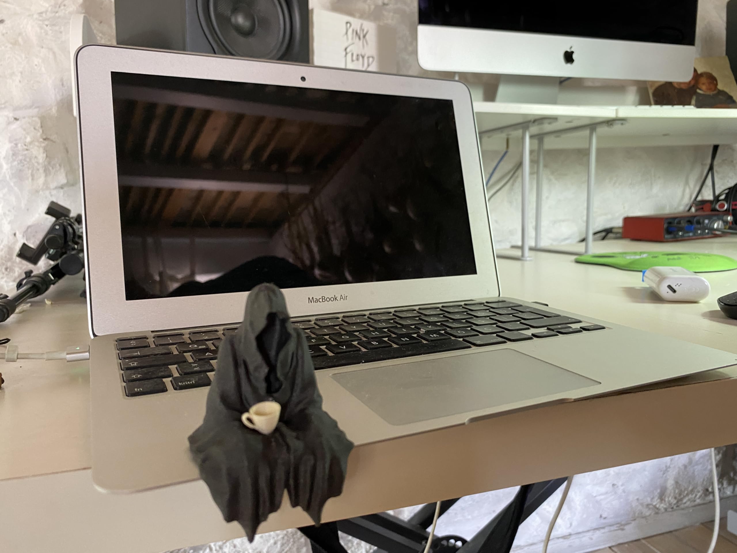 Tea cup holding ghost figurine as conversation starter