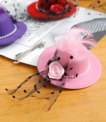 Laces feathers and pearls on mini hats in pink purple blue green