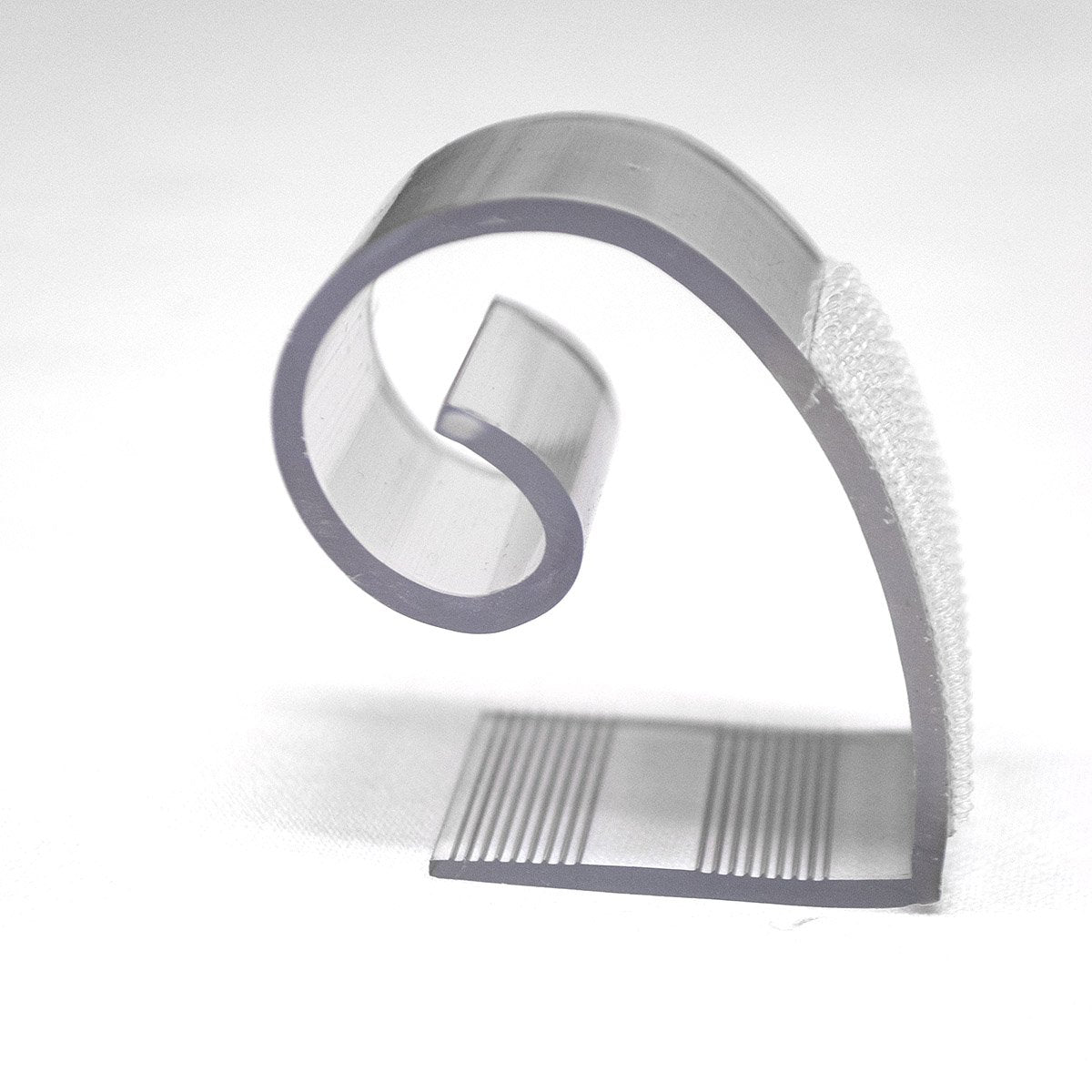 Hook and loop fastener attached to clip