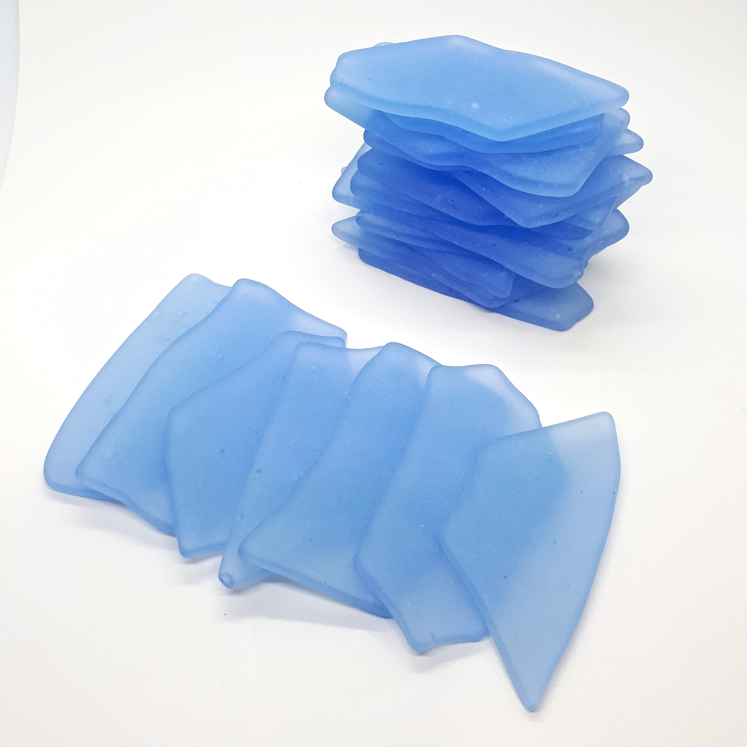 Irregular shaped sea glass place cards with flat surfaces