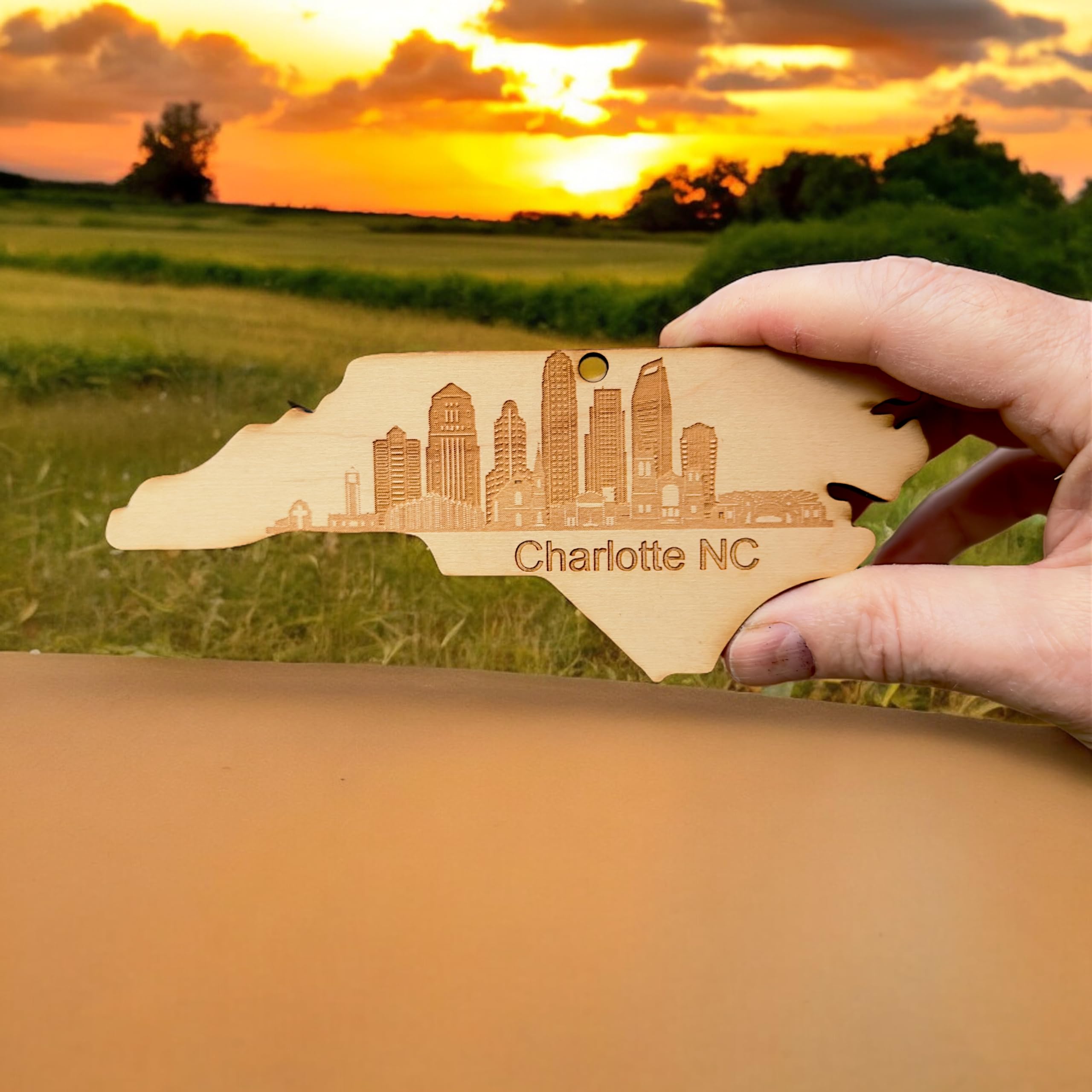 Skyline design on maple ornament