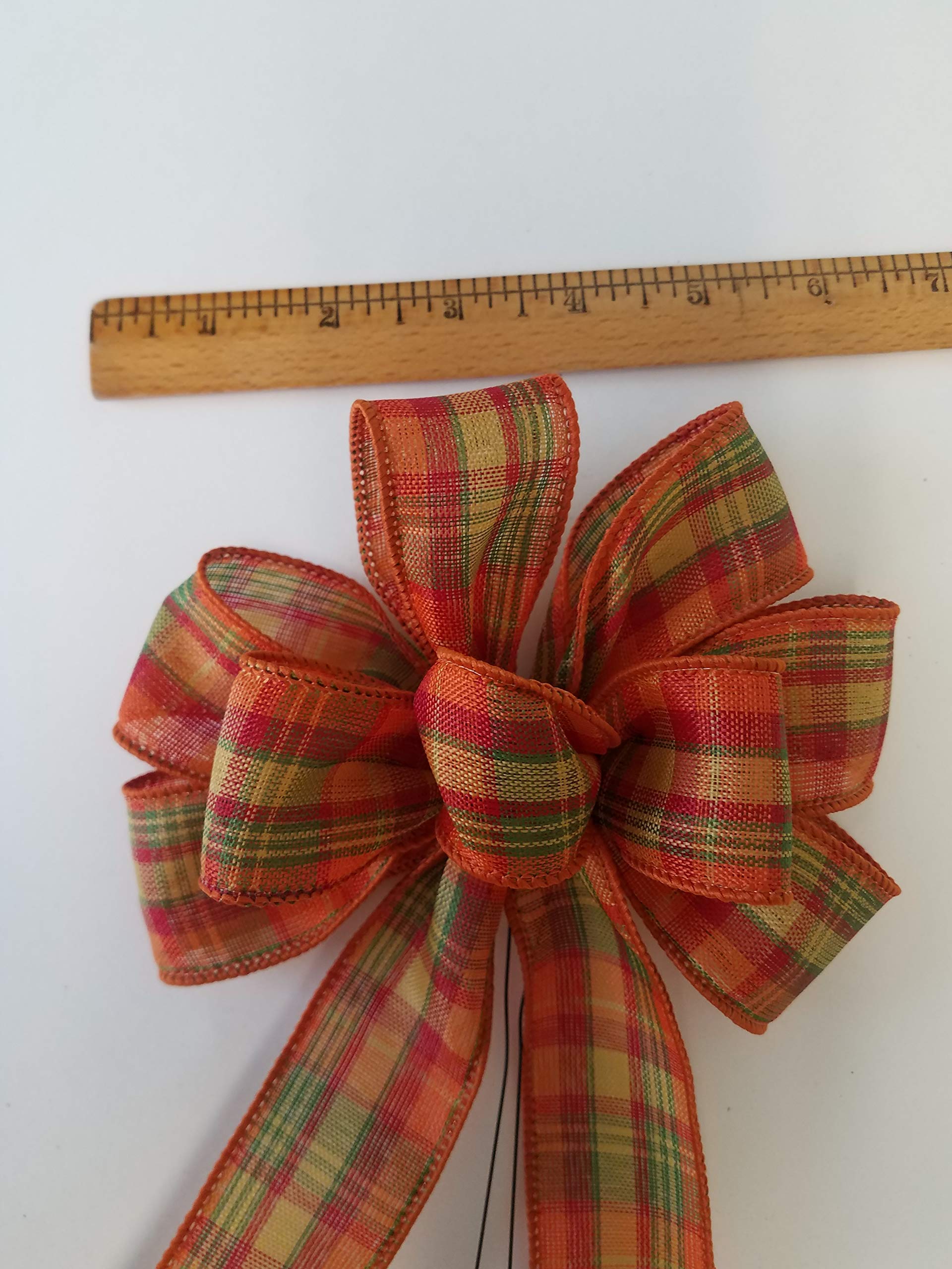 Bow measures 5-6 inches across and 10-11 inches long