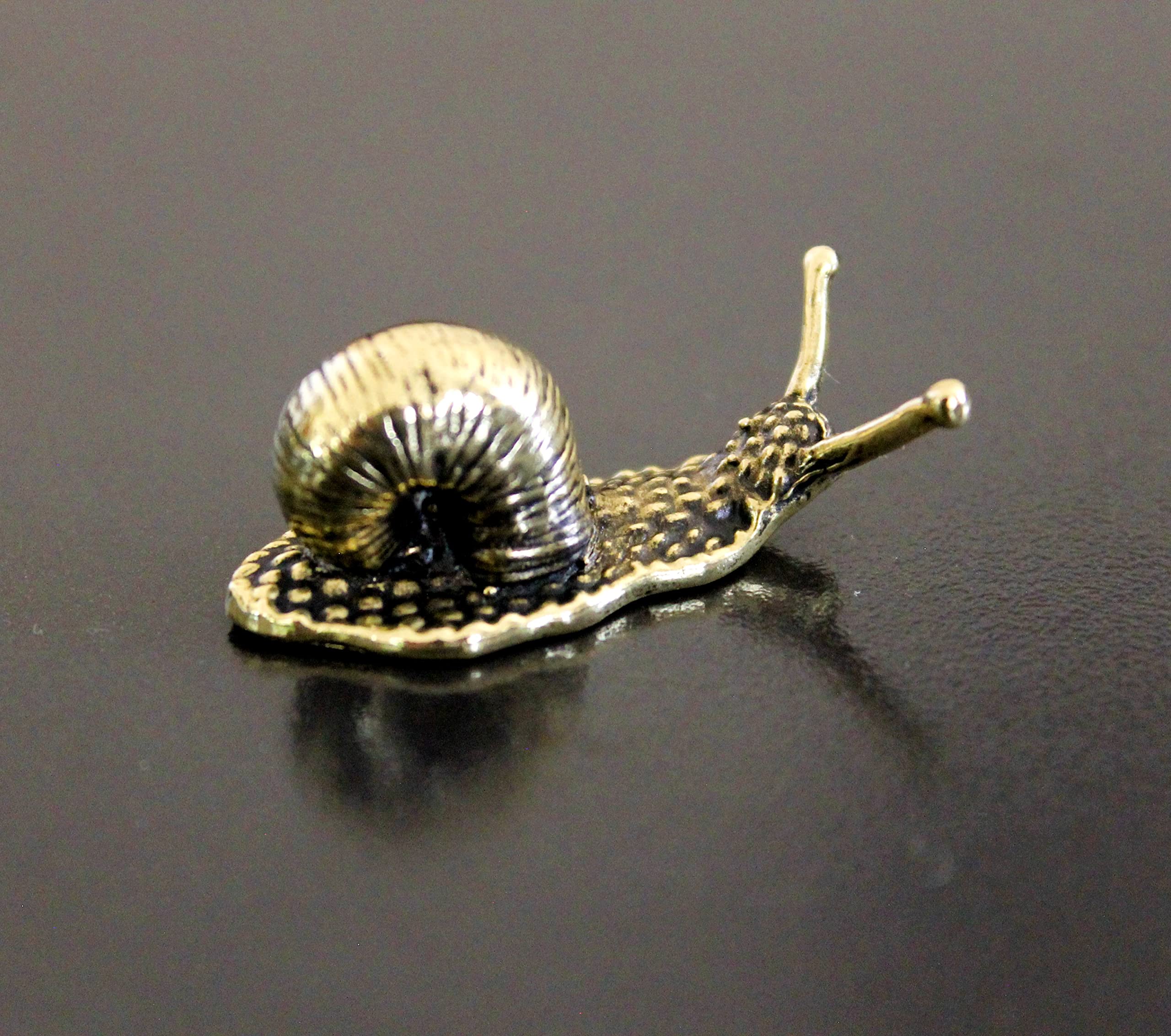 Small brass snail keepsake from a workshop