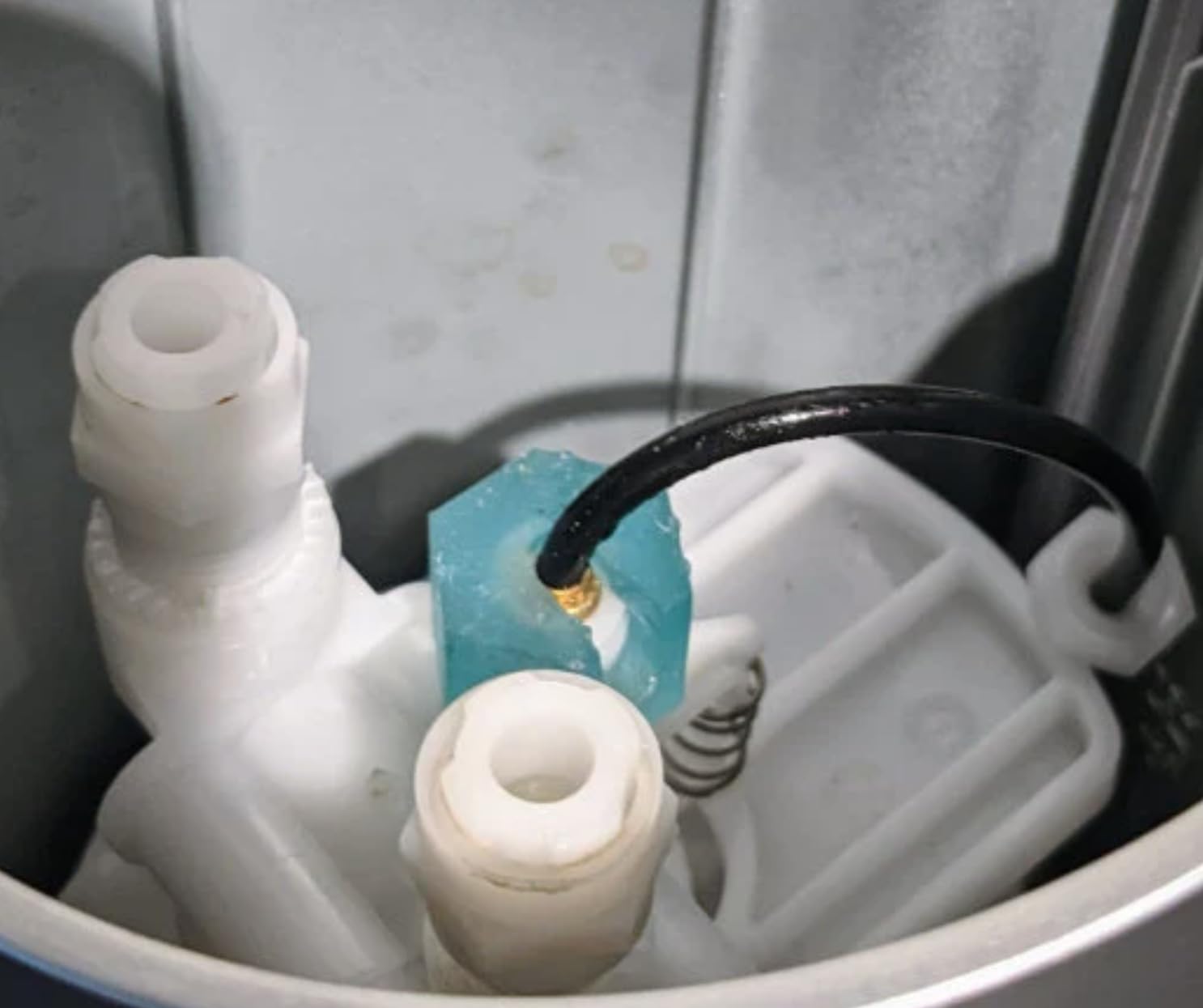 Hose passes through nut slot during installation