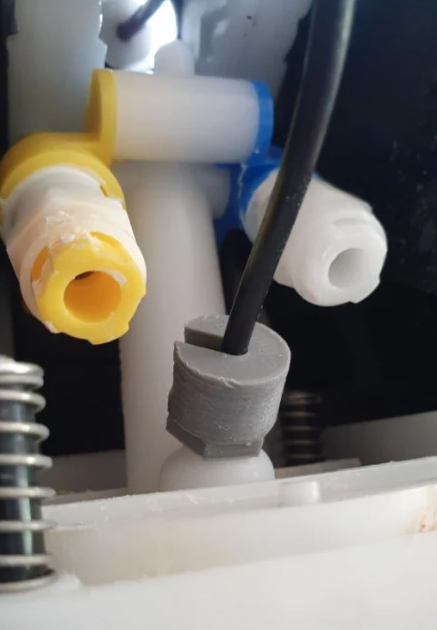 Nut connects black CO2 hose through slot in Soda Stream nut