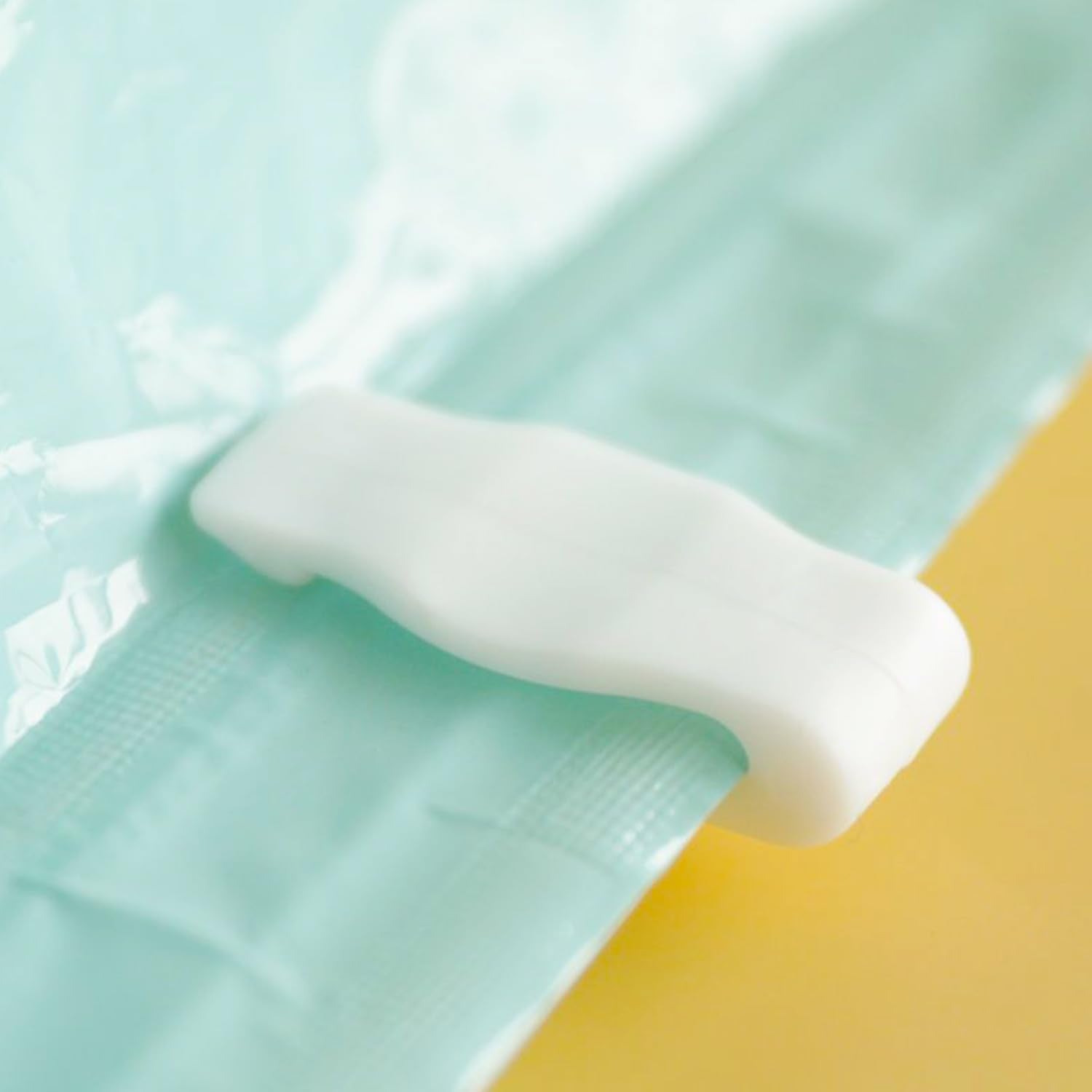 Space saving clip designed for bags and storage organization