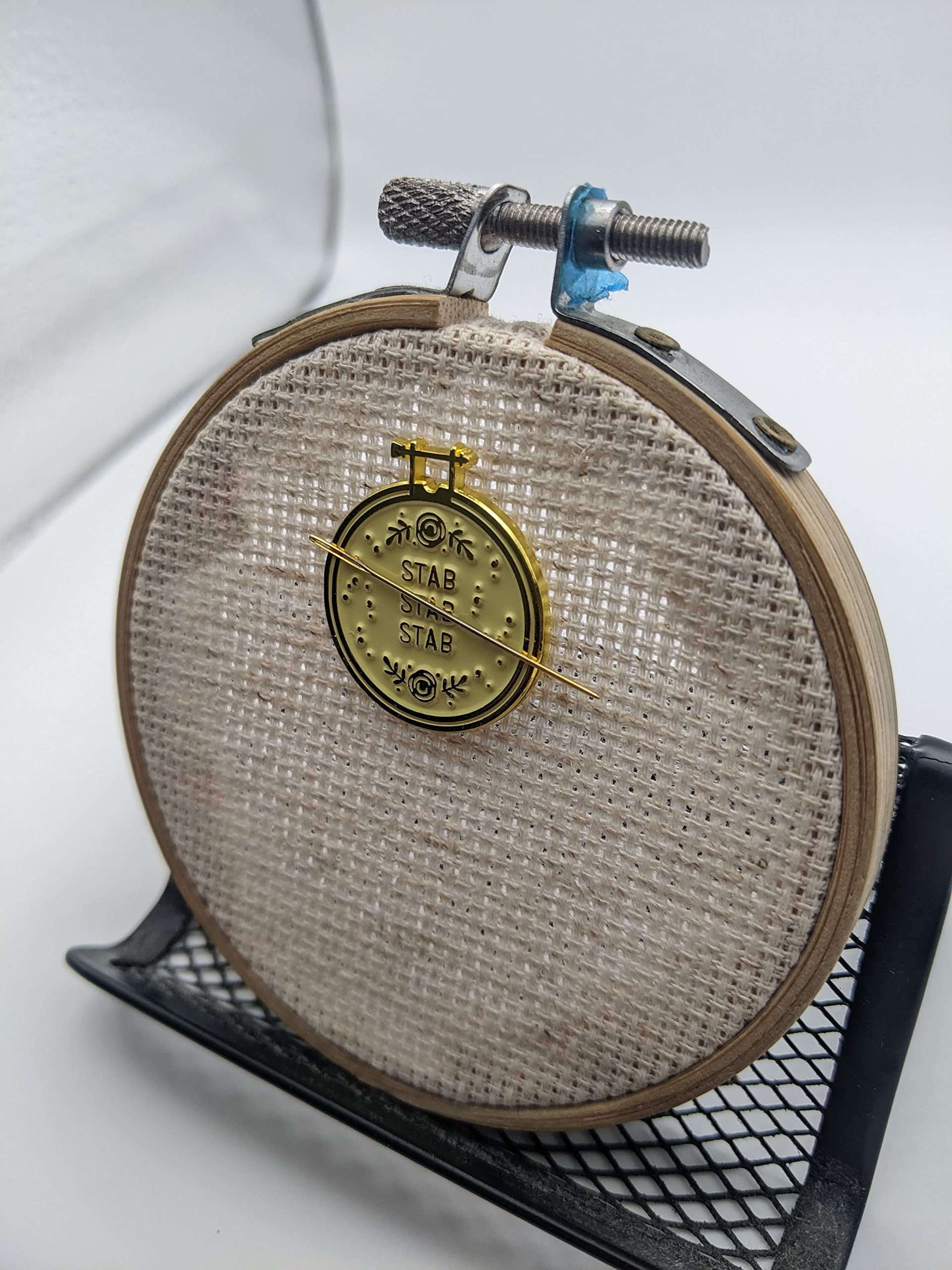 Needle resting on magnet during a break with Stabby Needle Minder