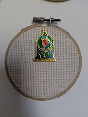 Back magnet on Stained Glass Rose Needle Minder securing to fabric