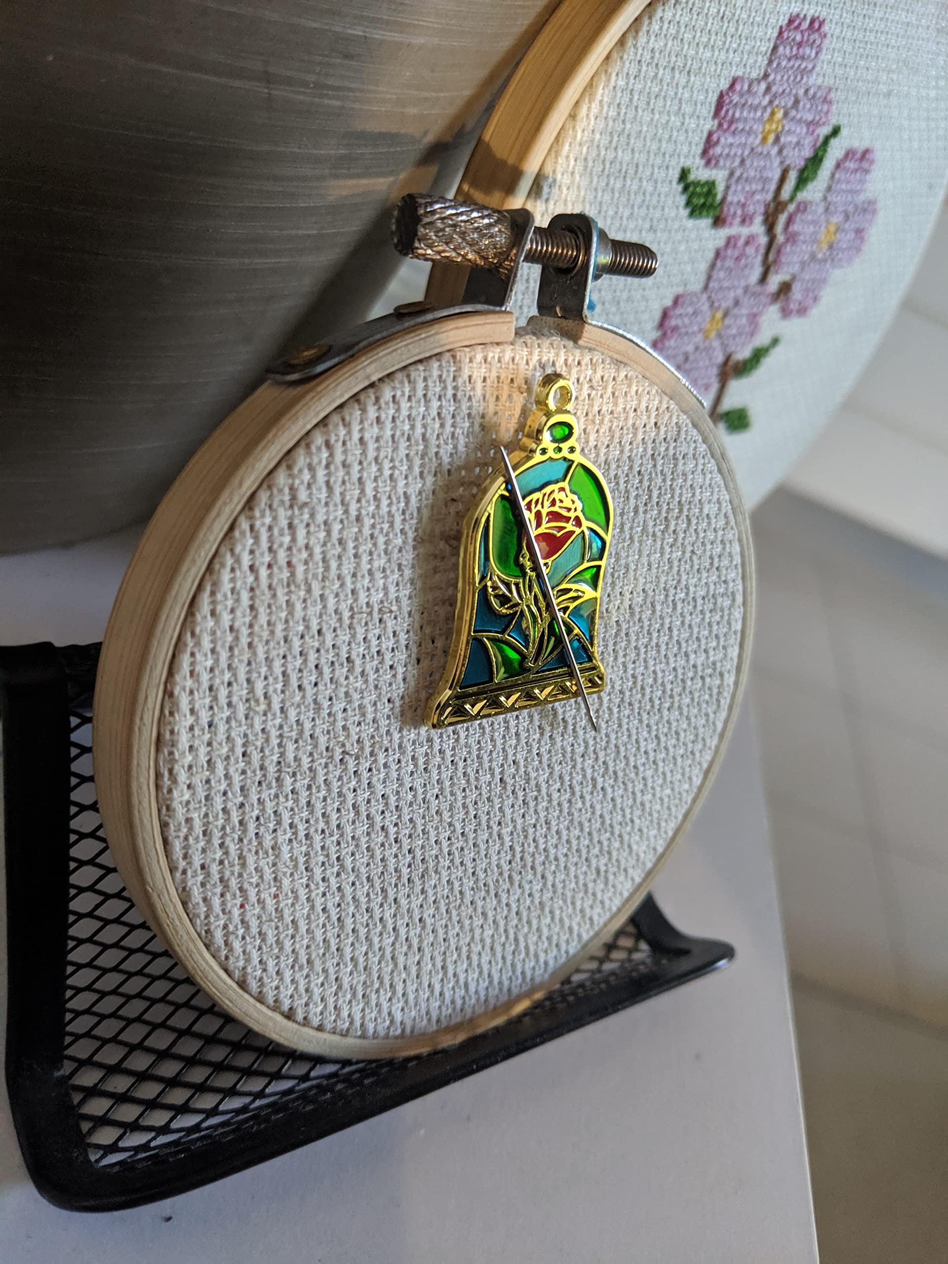 Stained Glass Rose Needle Minder placed on embroidery hoop for sewing