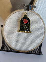 Stained Glass Rose Needle Minder with second magnet securing needle on hoop