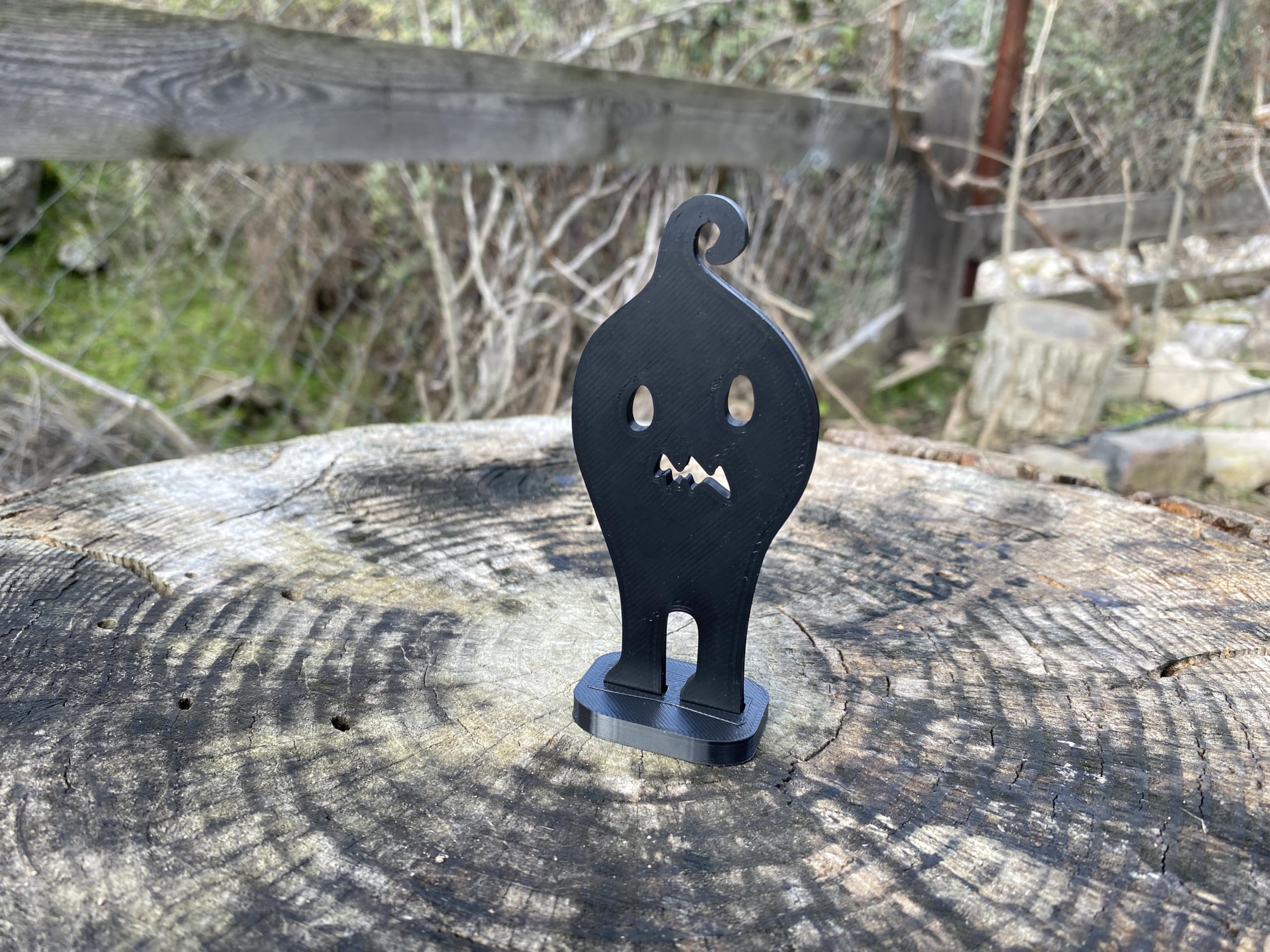 Stardew Valley inspired Krobus desk decor on bookshelf