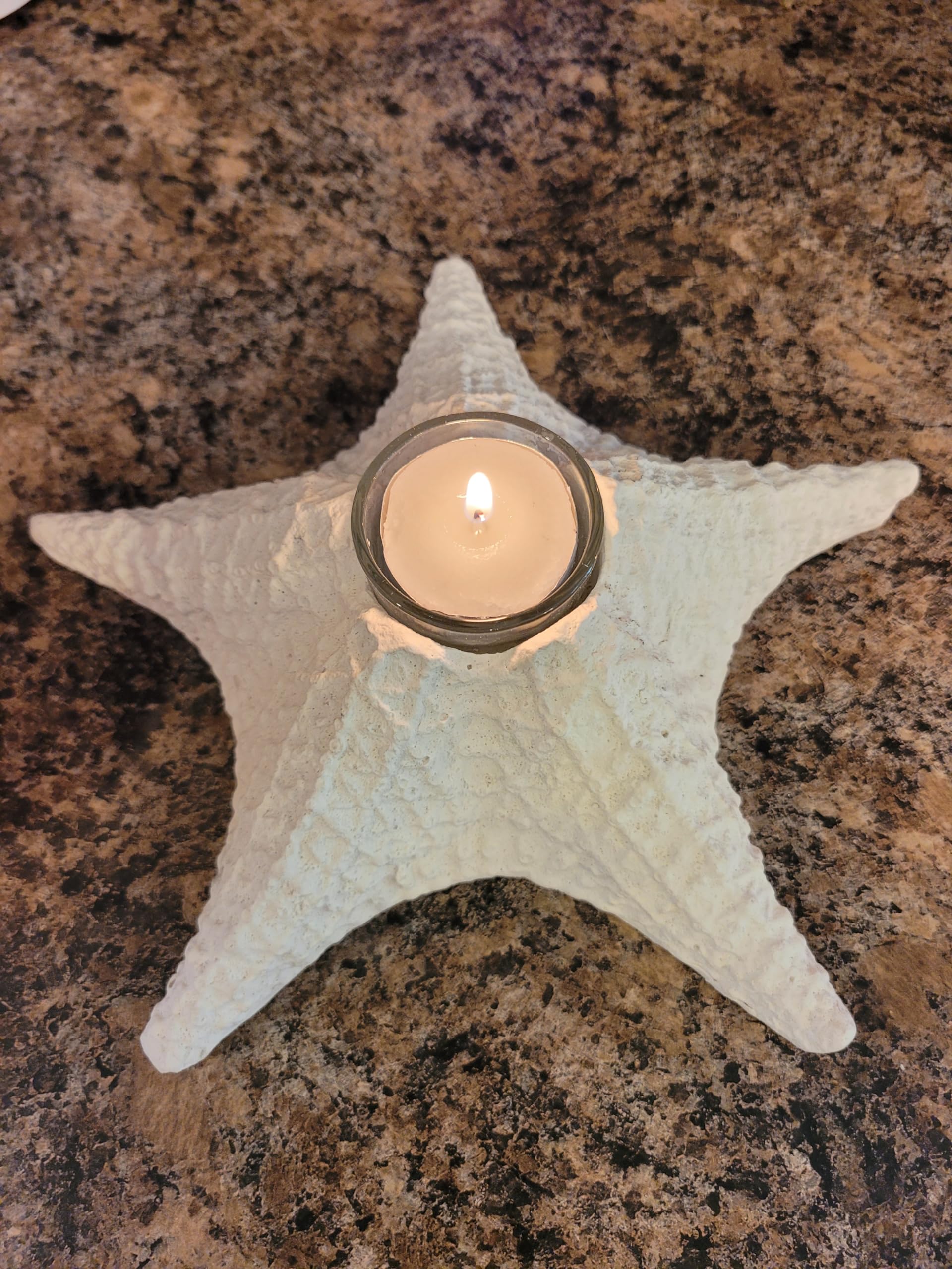 Glass tea light holder integrated into starfish design