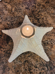 Glass tea light holder integrated into starfish design
